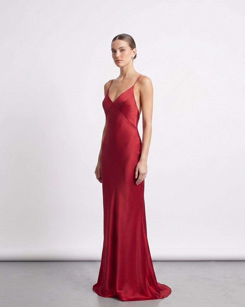 Red silk maxi dress, three-quarter view, studio